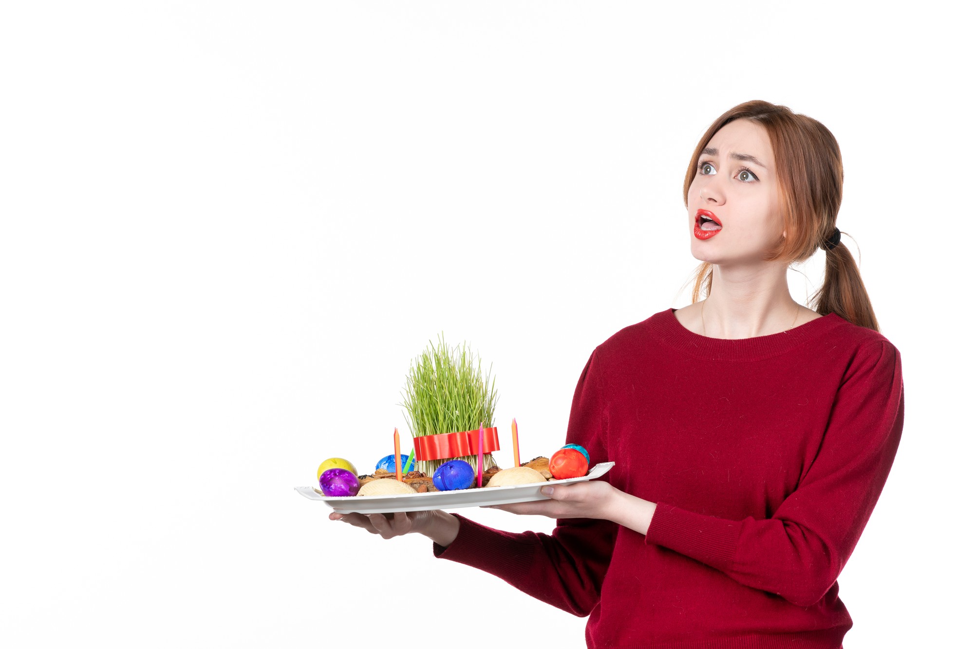 Close-up of student plating a composed salad